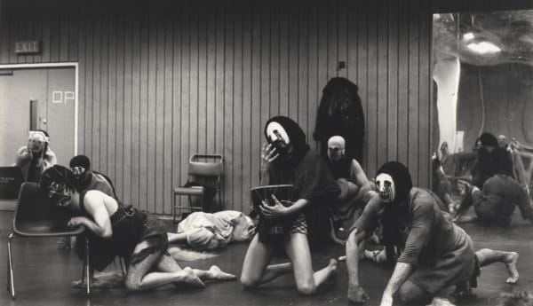 Actors with masks on rehearsing the play Furies