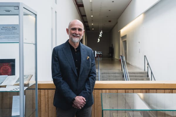 Clive Baillie stood on the mezzanine at LCC