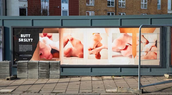 Photograph of a billboard featuring student work.