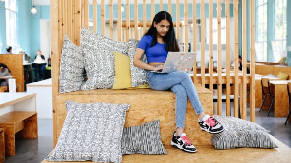 Student sitting in the canteen at Lime Grove, UAL School of Pre-degree Studies
