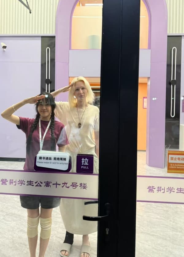 Two females saluting