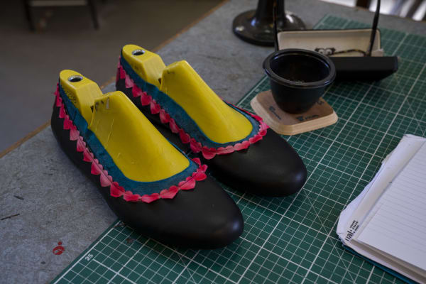 Black shoes on a work top