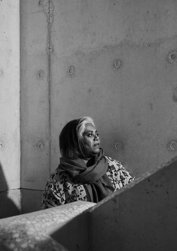 A black and white side portrait of Rathna