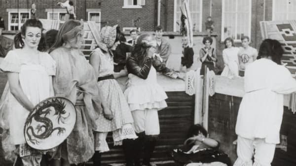 Black and white image of a group of students in costumes