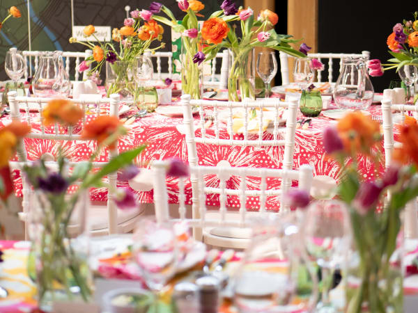 Tables and chairs decorated with flowers
