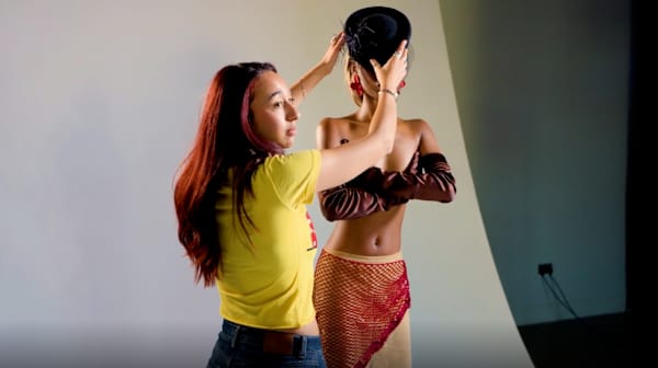 Student directing a model in a photo shoot during The Complete Stylist Short Course