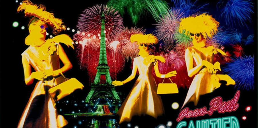 3 models in foreground; Eiffel Tower and fireworks in background