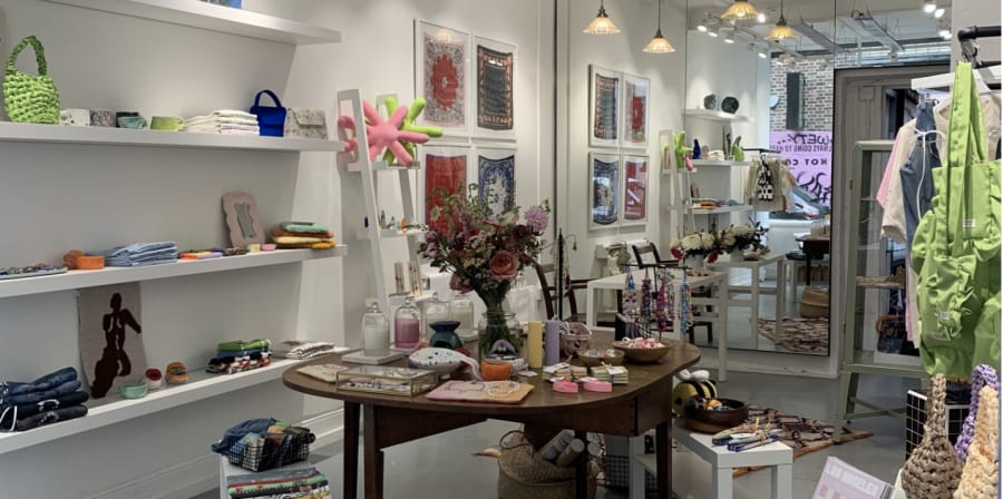 Photo of shop with clothes and home decor