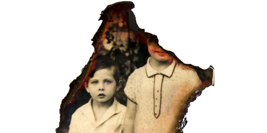 Photograph of two young boys burnt through installation, as part of 'My Name is Sara' exhibition by Sara Davidmann. 