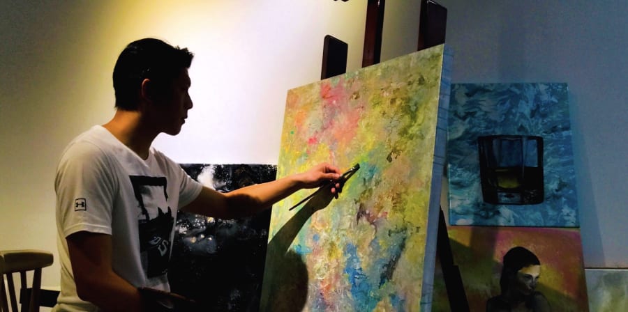 Man painting in a studio