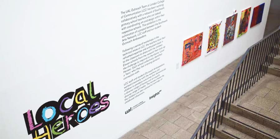 Image depicts the view of the Local Heroes exhibition from the main College staircase.