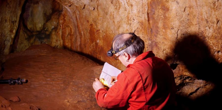 A photograph of Paul Pettit in a cave