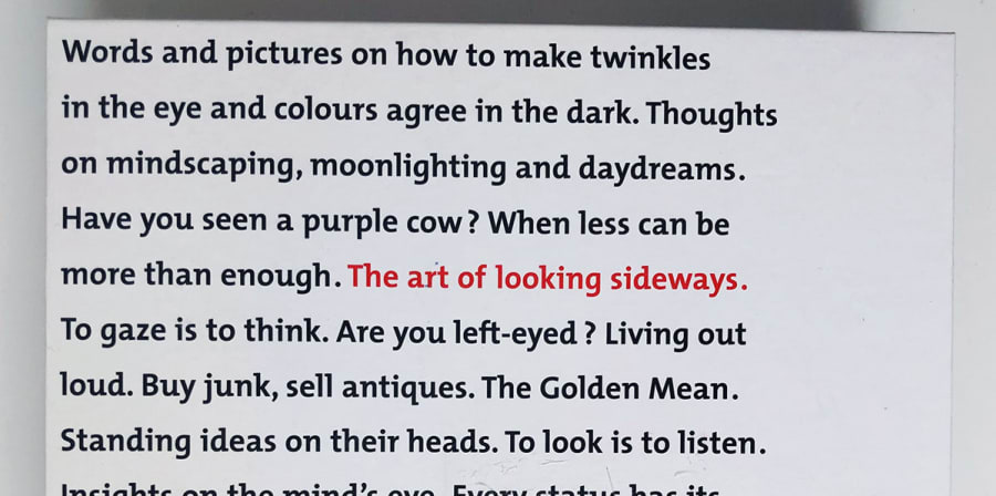The front cover of The Art of Looking Sideways is covered in text excerpts from the book.