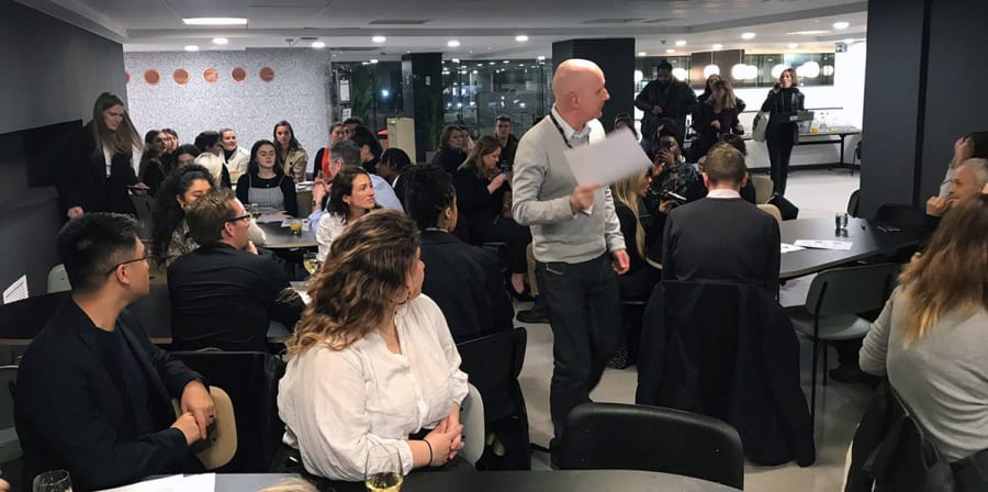 Students and guests listen to a speaker in LCC's Typo Cafe.