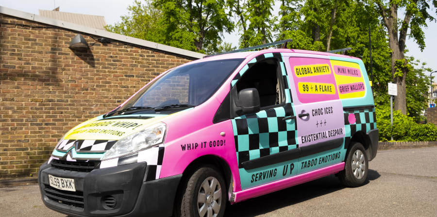 Fandangoe Whip Ice Cream van stationary on a road by brick wall