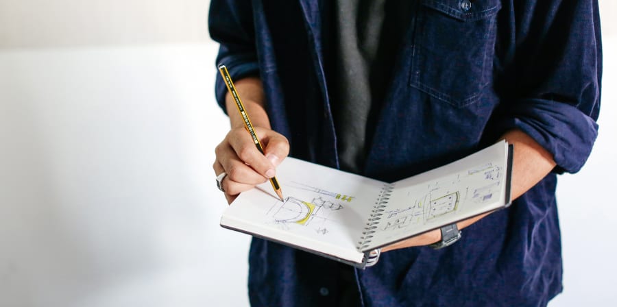 Student holding a sketchbook