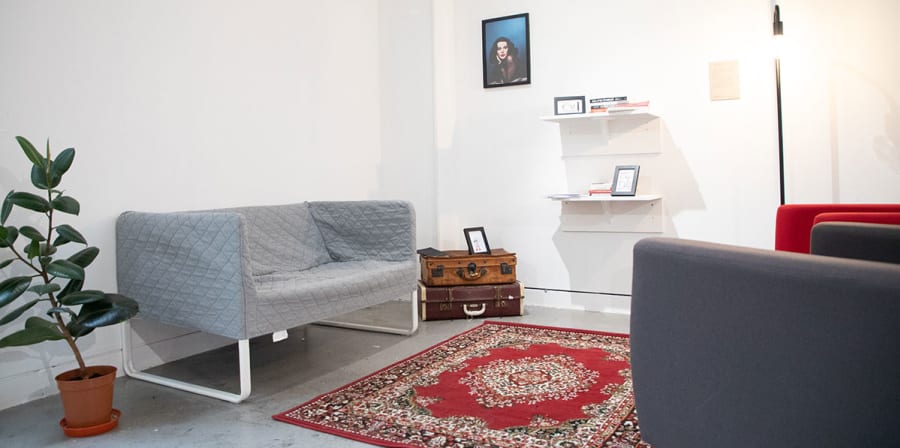 Part of the gallery space is partitioned to resemble a living room.