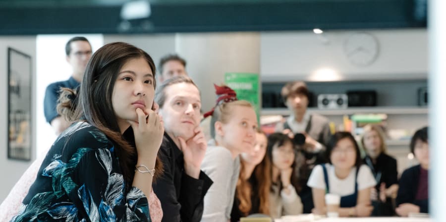 People listening to media at the Design Museum
