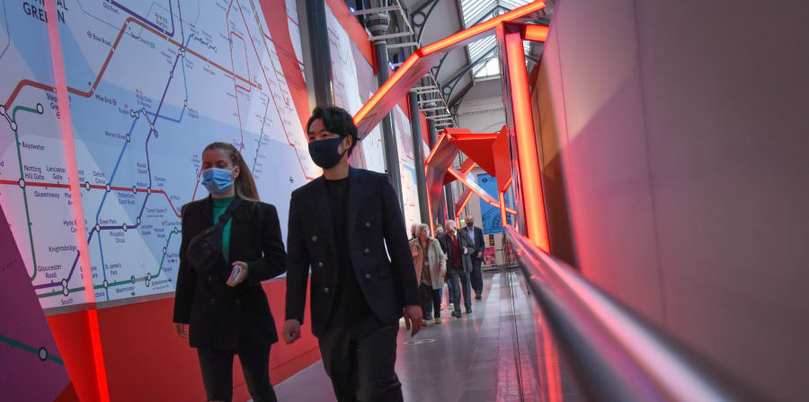 People walking down a corridor at London Transport Museum
