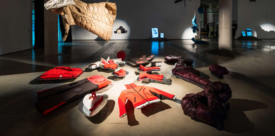 A shot of garments installed inside an exhibition space