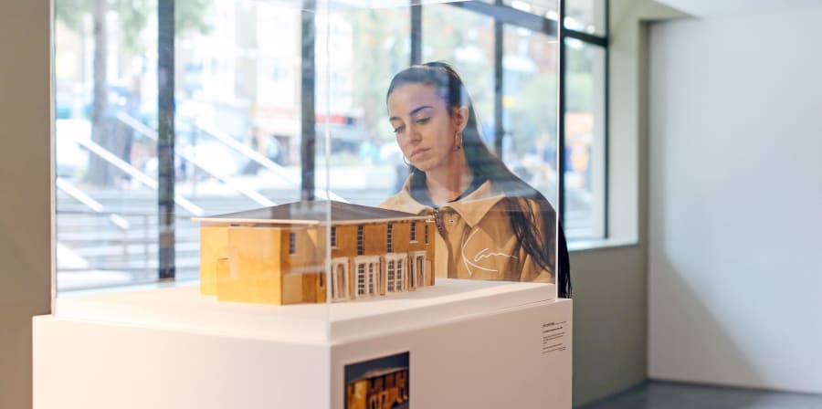 Girl examining an exhibit at a summer show