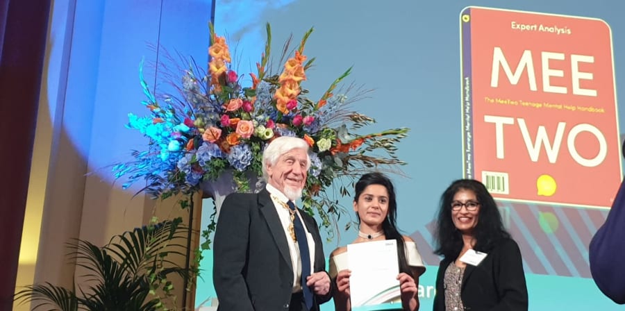Contributors to the MeeTwo handbook accept BMA award on stage