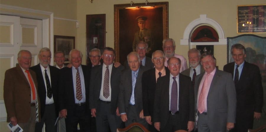 The group celebrates in the Queen Victoria Rifles' London Mess.