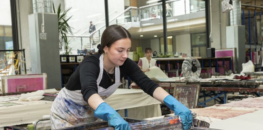 A student in the print and dye workshop