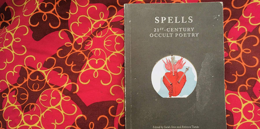 Image depicts Spells on a red and yellow patterned background.