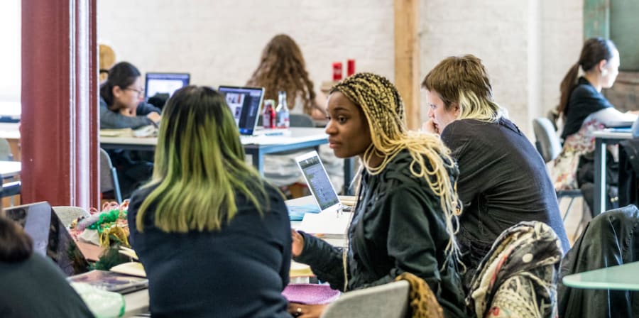 Students talking in the library