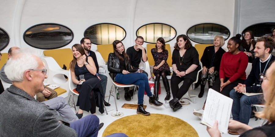 People sitting in a semi-circle
