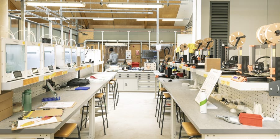 Wide shot of a workshop with rows of specialist 3D making equipment 
