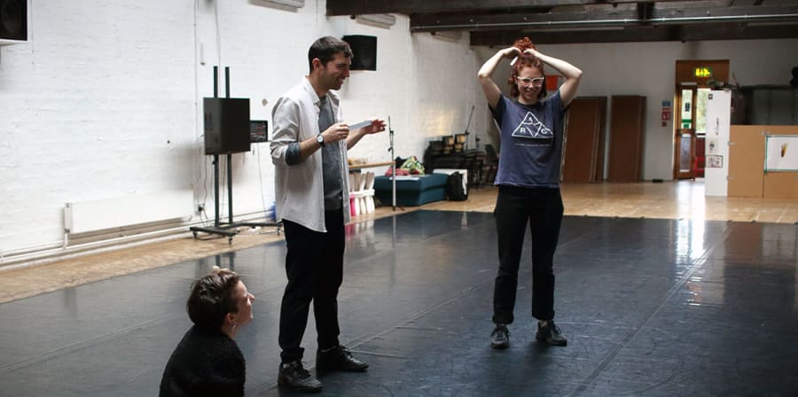 Dr Ed Webb-Ingall directs two students during the Tramway Festival in 2016.