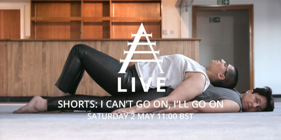 A still from the film, I Can't Go On, I'll Go On, featuring two people lying on top of each other.