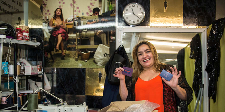 Claudia manages a sewing' business inside the shopping centre. She is receiving her new business cards designed by Lauren Vaughan.