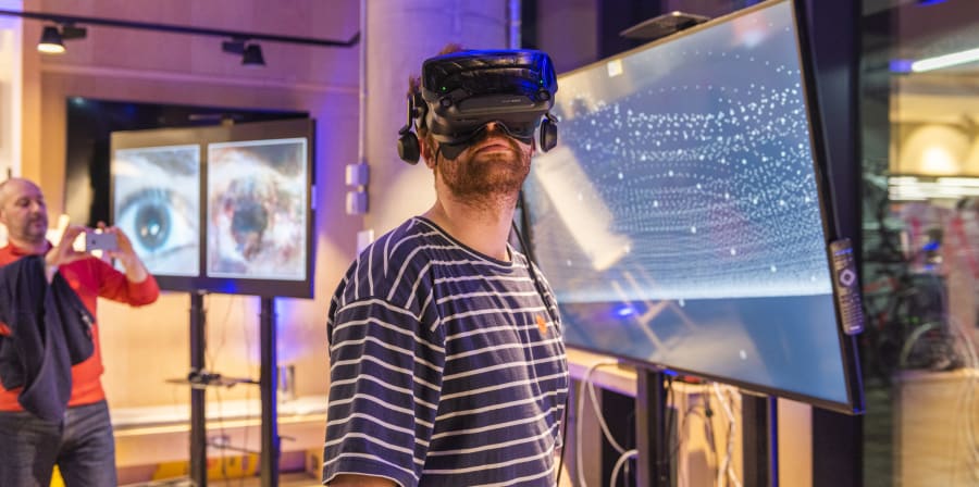 Visitor of the Creating Computing Institute wearing a VR headset