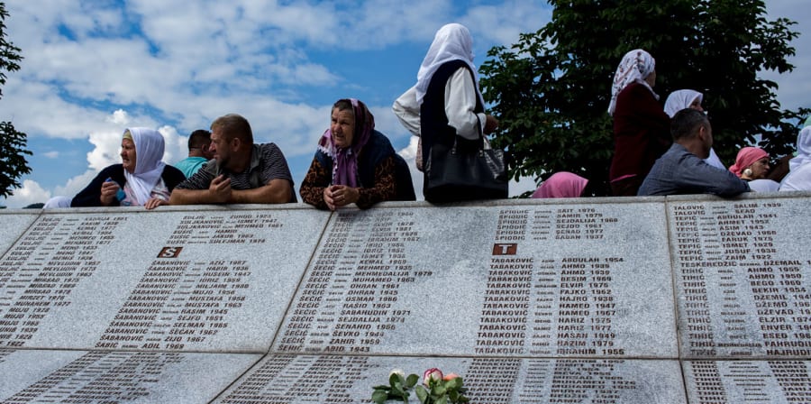 old women sitting on memorial
