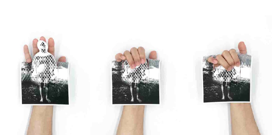 three hands hold postcards cut out