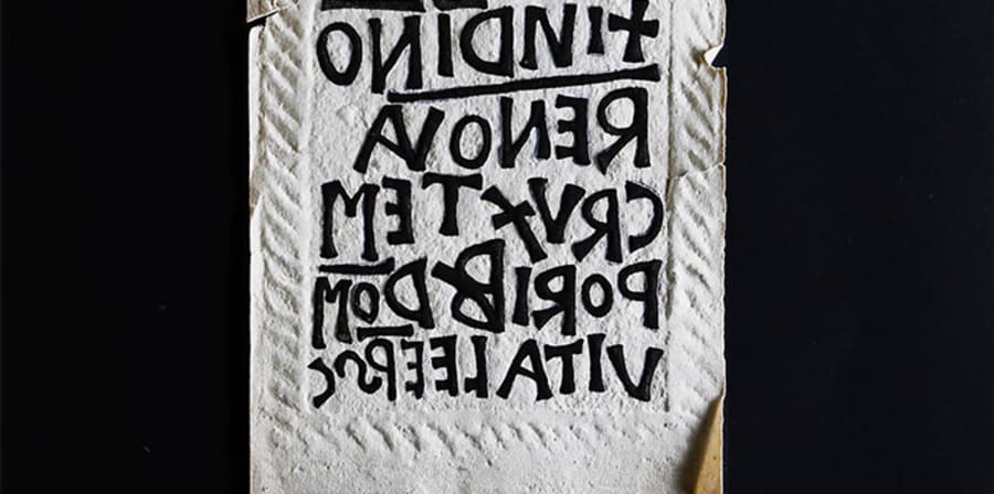 Roman lettering carved into a stone