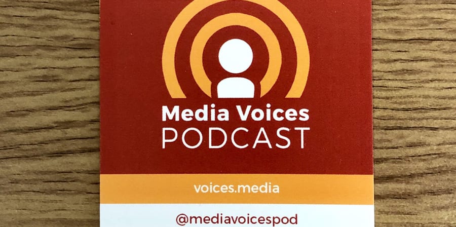 A business card featuring the microphone logo of the Media Voices Podcast.