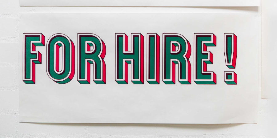 Photo of a letter print that says For Hire