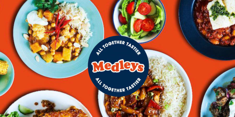 A red tablecloth covered in healthy fast-food, branded with a blue circle logo which reads 'Medleys'.