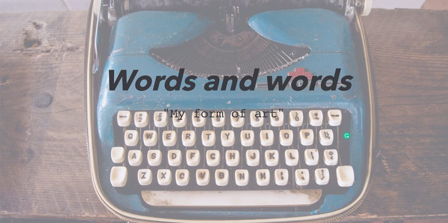 The text 'words and words' is printed over a photograph of a blue typewriter.