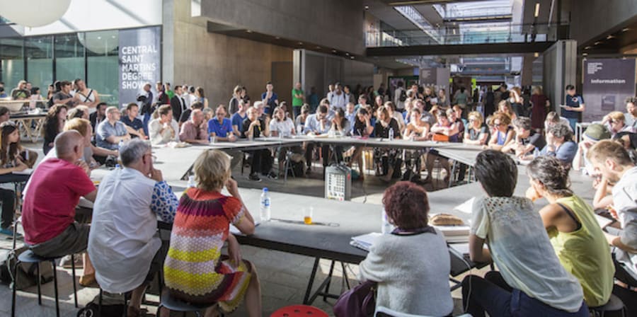 People sat around a large round table 