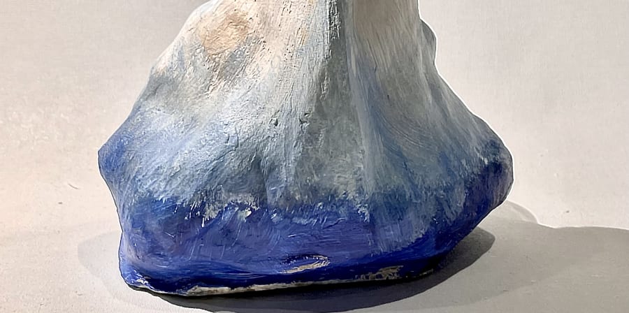 clay sculpture of an iceberg painted