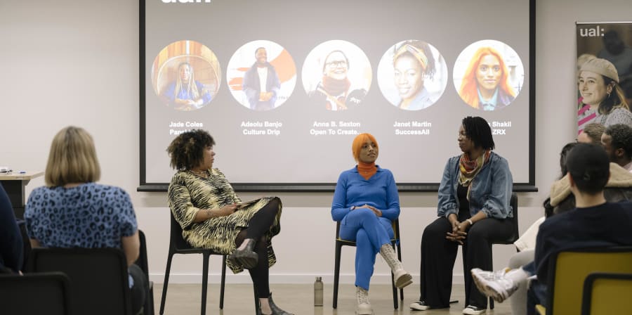 A group of people sitting in a circle discussing creative futures