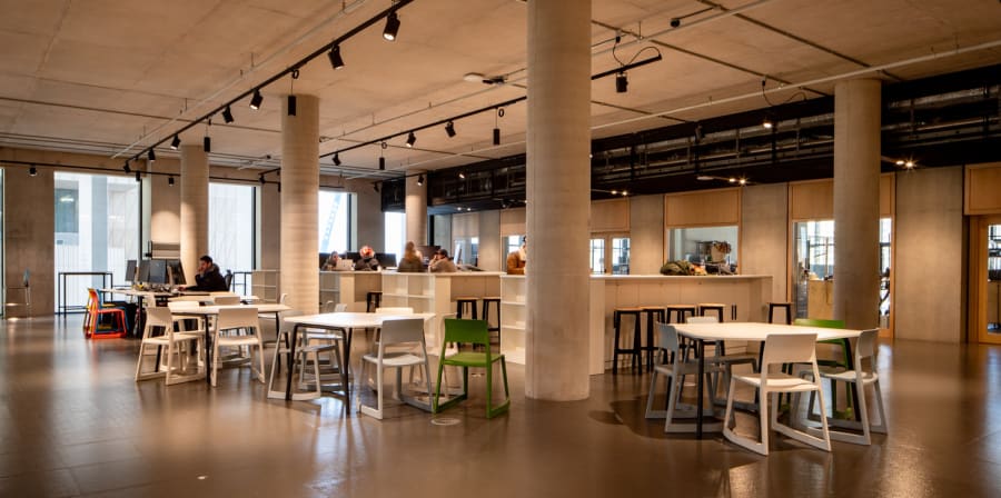 Photography of Makers Square - desks and equipment in the centre of the building floor.