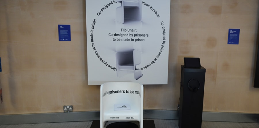 prison cell with plastic chair