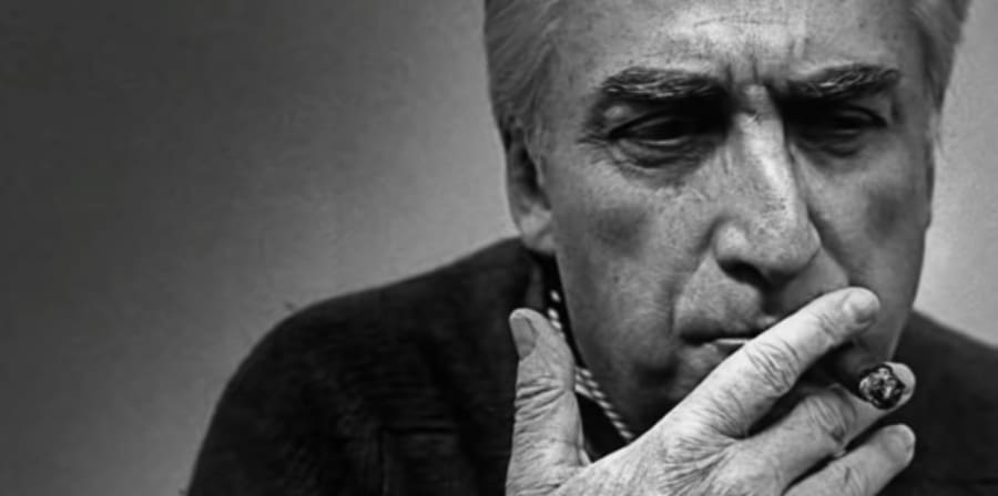 A black and white portrait of Roland Barthes