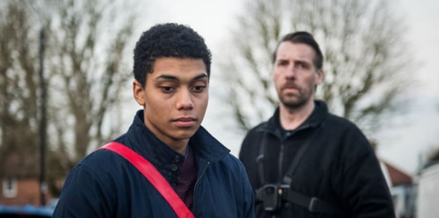 Still from the film Killed by my Debt, featuring the main and supporting character